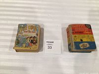 Overview of both comic books with lot tag