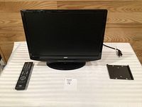 Front view of AOC HDTV with remote and wall-mount plate