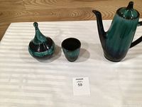 Three Blue Mountain Pottery pieces: coffee pot, lidded candy dish, cup