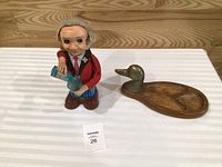 Overall view of both items: duck snack tray and Blushing Willy toy