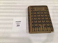 Front cover of Little Women hardcover showing title, author, pattern, and lot card