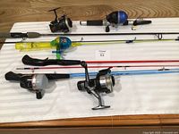 All five rod-reel combos laid out