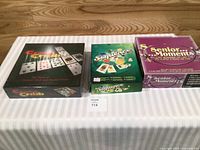 All four game boxes displayed on table