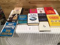 All 12 hardcover books laid out on table