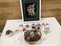 Group shot: 10 porcelain figurines, blown glass flower, wicker basket, framed art