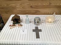 Group view of all six religious Christmas decor items on table