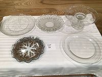 Group shot of cake stand and four serving plates