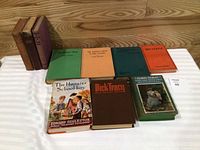 Group shot of all 10 hardcover books front covers visible