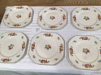 Six square floral plates front view