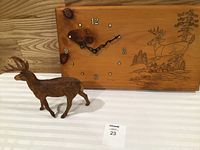 Clock and deer figurine overall