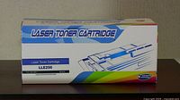 Box packaging of unopened Epson laser toner cartridge labeled LLE250