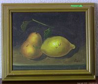 Full view of framed still life painting depicting a pear and a lemon with droplets, signed Grant.