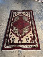 Full view of rectangular Persian Sarab rug laid out on floor, showcasing central medallion and border design.