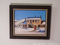 Frontal view of framed oil painting hanging on wall