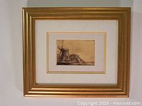 Full photo of framed etching showing the artwork with gold frame and double matting.