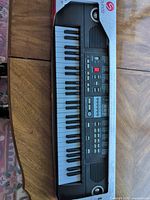 Left-side view showing keyboard length and partial packaging