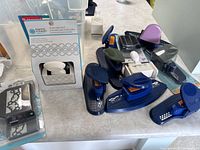 Various border punches and stamps arranged on a table, including loose and boxed items