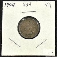 Front side of a 1904 US Indian Head Penny, showing Liberty's profile and date, mounted in a cardboard holder with handwritten notes.