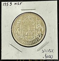 Reverse side of the coin with Canadian coat of arms and denomination, date marking 1953, details of silver content on holder.