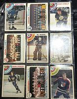 Photo of 9 O-Pee-Chee hockey cards from 1978-79 featuring players Mario Faubert, Terry O'Reilly, Bill McKenzie, Brian Spencer, Nick Fotiu and team photos of Colorado Rockies, Atlanta Flames, Washington Capitals.