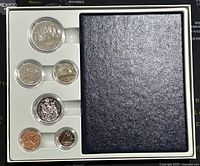 Full set in original packaging including 6 specimen coins and blue folder.