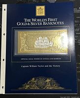 Blue folder cover showing title and visible banknote encased with gold and silver print.