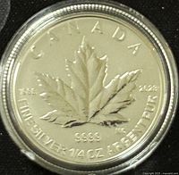 Obverse view showing the Canadian Maple Leaf with purity and weight inscriptions.