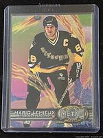 Front side of 1997 Fleer Metal Mario Lemieux hockey card showing player in black Pittsburgh Penguins uniform with holographic flames background.