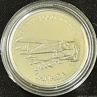 Obverse side of 1999 Canadian 25 cent silver proof coin showing airplane design and date.