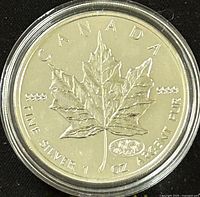 Obverse side showing the maple leaf with purity markings and Millennium privy mark
