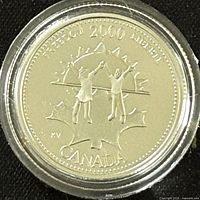 Reverse side of the coin showing two figures holding hands, maple leaf background, year 2000 and Millennium series markings.