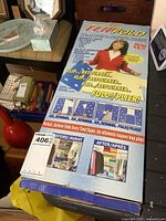 Photo of the Flip Fold laundry folder device box showing product branding and usage information.