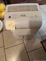 Full view of Claude 12.5L dehumidifier unit with front unload bucket and control panel on top.