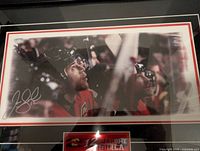 Framed color photograph of Jarome Iginla in Calgary Flames uniform, signed by the player.