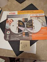 Full packaging showing two Kidde LED escape light smoke alarms with LED and safety certifications.