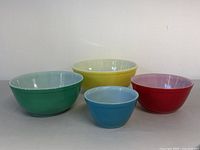 Set of 4 mixing bowls shown separately, each a different color (yellow, green, red, blue)