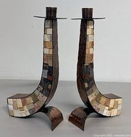 Front view of pair of vintage copper Shabbat candlestick holders with multicolor stone mosaic inlay