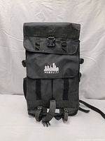 Front view of a large black Citypak backpack showing the flap top secured with a buckle and front pocket with Citypak logo.
