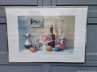 Full frontal photo of the framed print showing the entire artwork with fruit, glassware, and bottle elements.