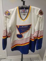 Front view of vintage St Louis Blues jersey with CCM tag and team logos sewn on chest and sleeves.