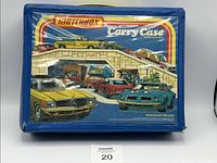 Front view of blue vinyl Matchbox Carry Case with colorful vintage car graphic