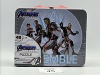Front view of metal box packaging showing Avengers Endgame 48-piece puzzle graphic and dimensions 7.5 x 11.25 in / 19 x 28.5 cm.