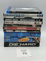 Front view of stacked DVDs and Blu-rays showing the titles and cases.