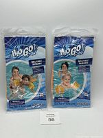 Two pairs of H2O GO! inflatable water wings in original sealed packaging, showing front packaging with pictures of children and branding.