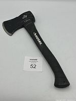 Full view of Husky hatchet showing black rubberized handle and metal hatchet head with 1.25 lb weight marking.