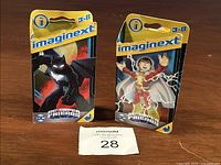 Two Fisher Price Imaginext DC Super Friends action figures in packaging, Batman and Shazam, age range 3-8.