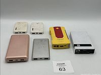 Six portable power devices including power banks and jump starters shown from the front, including some with visible USB ports.