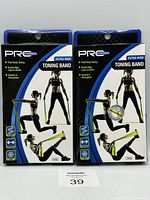Front view of two Pro Strength Extra Wide Toning Band packages in unopened condition showing branding and exercises.