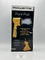 Front side of Rowenta Pure Pop handheld garment steamer box showing product image and marketing text including rapid heat up, versatile pad, and compact design.