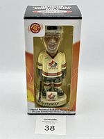 Front view of boxed Steve Yzerman Team Canada bobblehead showing detailed figure and labels on front of box.